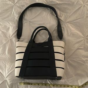 Madison West navy and white bag with inside liner and shoulder strap.